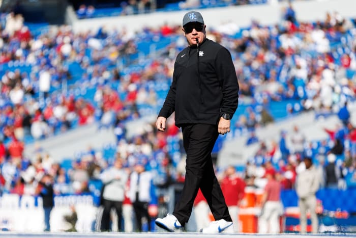 Kentucky Wildcats head coach Mark Stoops walks across the field before the game against the Alabama Crimson Tide at Kroger Field.